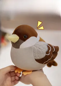 Close-up of a cute sparrow plush toy with soft brown feathers and detailed yellow beak