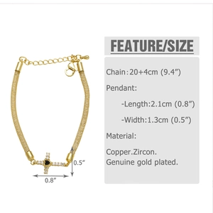 Detailed view of gold plated mesh bracelet with zircon cross and heart stone pendant