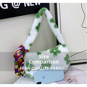 Detail of plush flower shoulder bag with colorful scarf beside a phone for size reference