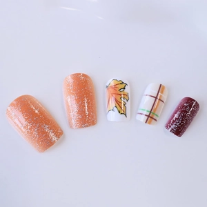 Autumn orange maple leaf and plaid press-on nails with glitter finish in medium length