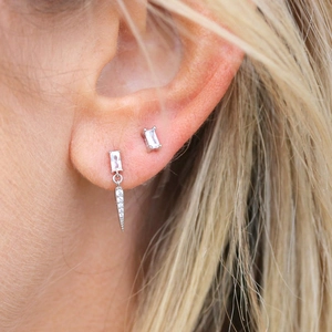 Detail of S925 silver needle square zircon earrings and spike pendant on model