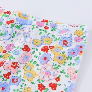 Elastic cotton leggings for girls with vibrant all-over floral print and durable stitching