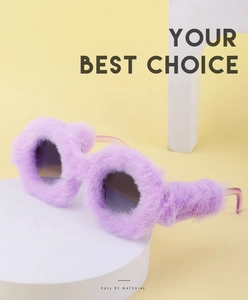 Detail of round sunglasses with purple faux fur frames on yellow geometric background