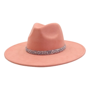 Detail of coral pink suede fedora hat with sparkling rhinestone band and wide brim