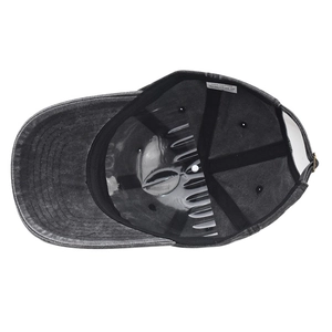 Detail view of cotton baseball cap interior showing 100% cotton label and metal buckle
