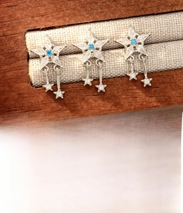 Detailed view of silver star ear stud with blue zircon and titanium steel dimensions