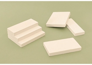 Close-up of beige wooden rectangular blocks stacked as miniature stairs for dollhouse DIY