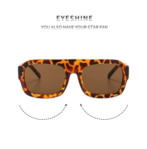 Detail of trendy tortoiseshell square sunglasses with brown lenses and thick retro frame