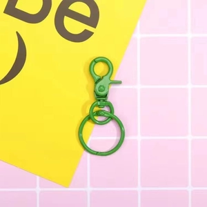 Detail of grass green metal lobster clasp with swivel ring for DIY bag accessories