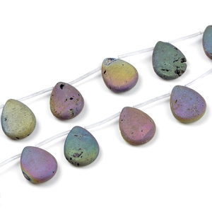 Macro shot of iridescent water-drop beads with natural textures for DIY jewelry making