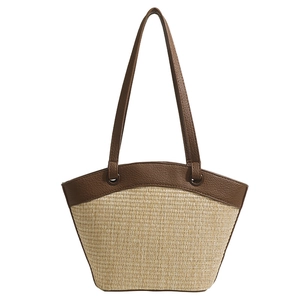 French retro straw tote bag with dark brown leather straps for beach vacations