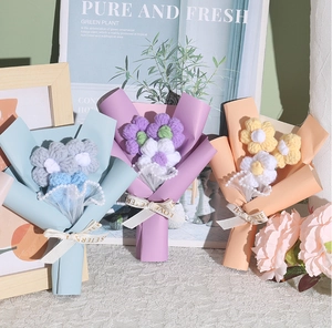 Close-up of three handmade crochet mini bouquets for Mother's Day with Love Eternal ribbons
