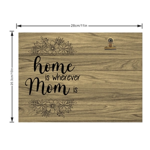 Detail of wooden picture frame with metal clip and Home is wherever Mom is quote