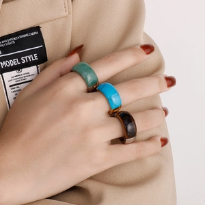Three-piece stainless steel ring set with green, blue, and tiger eye stone inlays