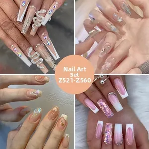 Detail showing various press-on nails with 3D snake motifs and shimmering butterfly gems