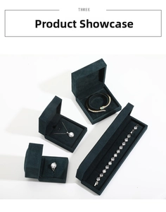 Detailed set of jewelry including ring, necklace, and bracelet in green velvet box