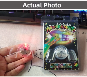 Detail of colorful LED flashing mouthpiece with packaging for Halloween party use