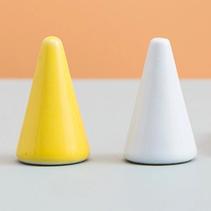 Minimalist ceramic cone ring stands in yellow and white colors for jewelry display