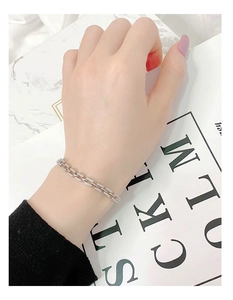 Close-up of 925 sterling silver chain bracelet with shimmering cubic zirconia stones