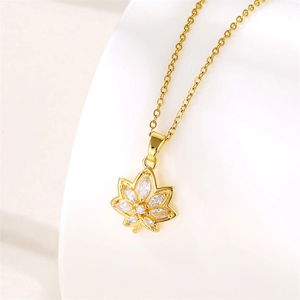 Elegant gold maple leaf pendant necklace featuring sparkling marquise cut zircon stones
