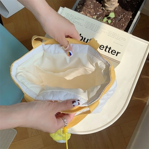 Internal view of the quilted floral tote bag showing spacious storage and inner pocket