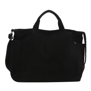 Large black corduroy tote bag with adjustable shoulder strap and side pocket design