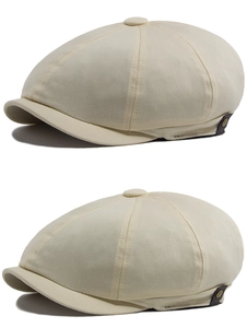 Detail view of beige newsboy cap showing twill cotton texture and side metal button