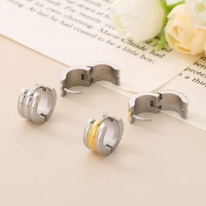 Polished 18K gold plated stainless steel triple row huggie earrings on aesthetic backdrop
