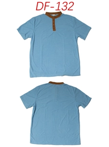 Detail of light blue short-sleeved polo with textured fabric and buttoned mandarin collar