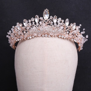 Close-up of handmade crystal beaded bridal crown with rose gold metal base