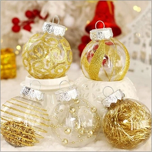 Set of five 6cm clear PET Christmas balls with gold glitter patterns and festive fillings