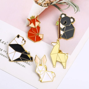 Set of five geometric animal enamel pins featuring fox and rabbit on decorative paper