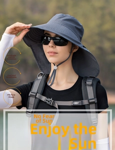 Detail of wide brim sun hat in dark grey with adjustable chin strap for hiking