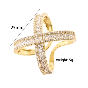 Detailed view of gold crisscross ring with cubic zirconia stones, size 25mm, 5g weight