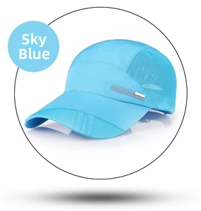 Detail of sky blue sports cap showing breathable mesh fabric and metal Sports badge