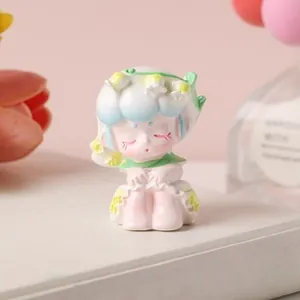 Macro shot of a cute girl resin figurine with lily of the valley flowers on a desk