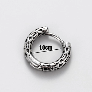 Macro detail of vintage skull totem silver earring showing 1.0cm inner diameter size