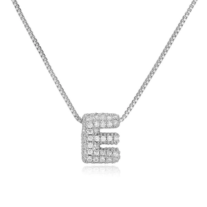 Detailed close-up of a silver bubble letter E pendant necklace with sparkling cubic zirconia
