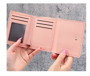 Pink PU leather short wallet interior with multiple card slots and clear photo window