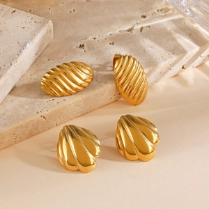 Elegant gold-plated stainless steel oval and shell-shaped earrings on stone background