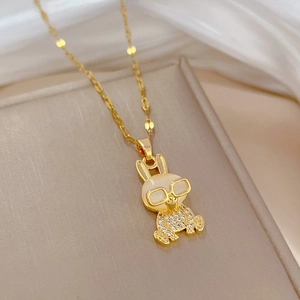 Detailed close-up of a gold rabbit pendant necklace with opal head and sparkling crystals