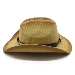 Classic straw western cowboy hat with wide brim and brown band for sun protection