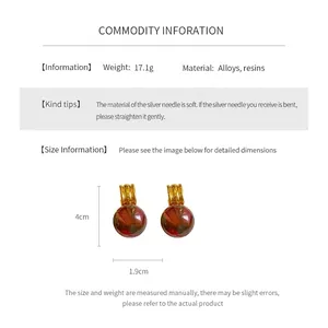 Detailed dimension guide for reddish-brown resin earrings with golden metal buckles