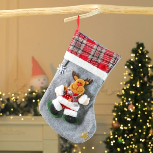Detail of grey plush Christmas stocking with 3D reindeer doll and red plaid cuff decor