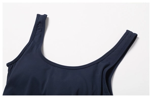 Close-up of navy blue yoga jumpsuit featuring premium double-stitch seams and U-neckline