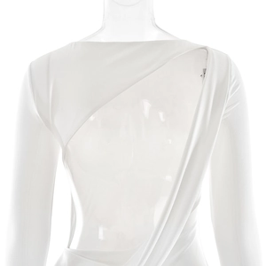 Detail view of white long sleeve dress with sexy open back and asymmetric draped cut