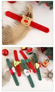 Close-up of festive Christmas plush slap bracelets with Santa and reindeer designs