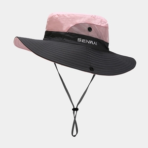 Detail of pink and black outdoor sun hat with breathable side mesh and adjustable strap