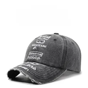 Close-up of vintage washed baseball cap with letter embroidery and distressed details