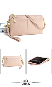 Pink lychee texture crossbody bag with multiple gold zippers and adjustable strap detail